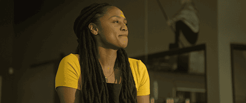 A proud hard working woman looks off into the distance in a production still from the motion picture, "The Remedy for a Broken Heart" produced in association with Tame Rabbit.